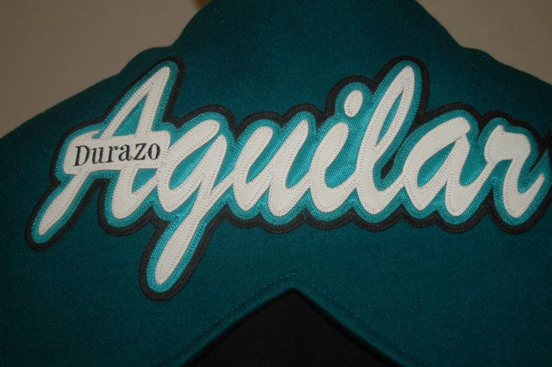 Custom leather last name with additional embroidery.