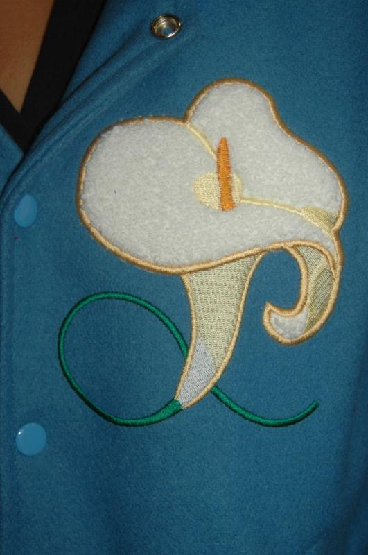 Custom chenille patch sewn directily onto the wool body. One of a kind design and application.
